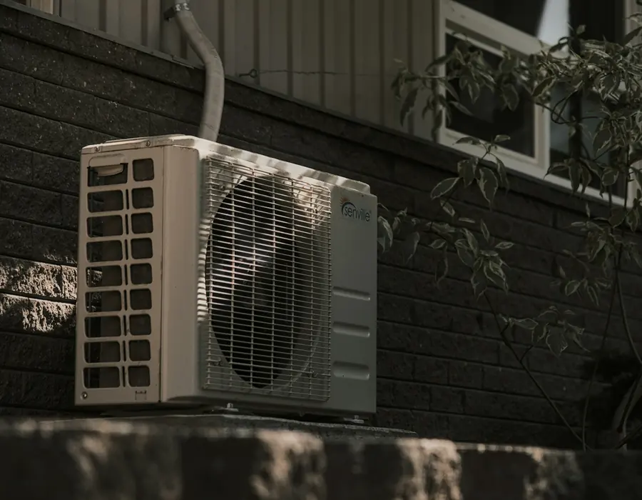 Split air conditioner outdoor unit installed on a building wall