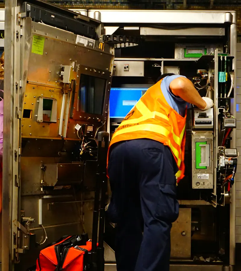 Maintenance technician servicing building equipment