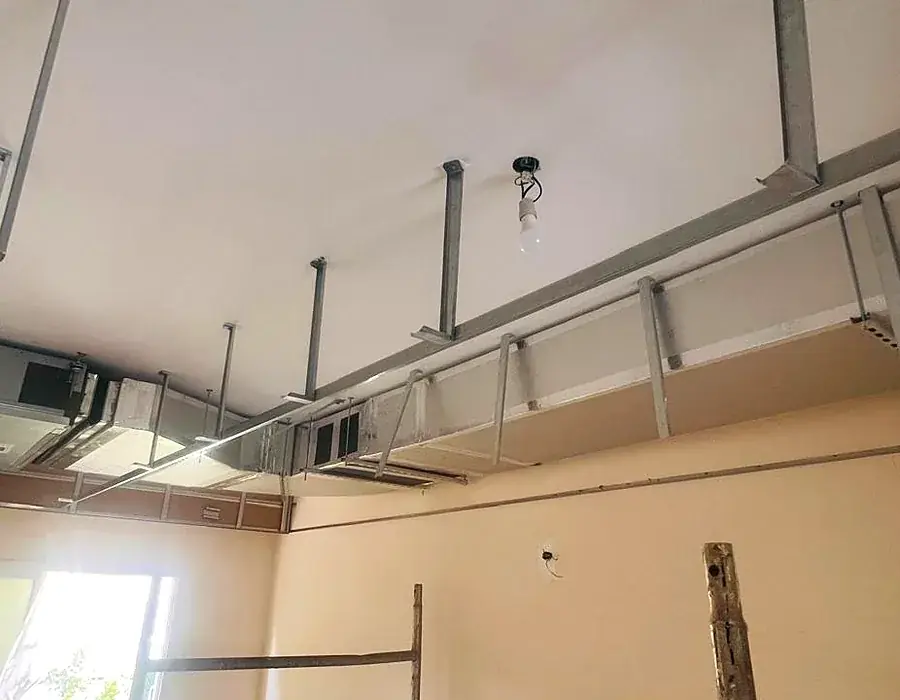 Ceiling ductwork and HVAC works in a hotel apartment