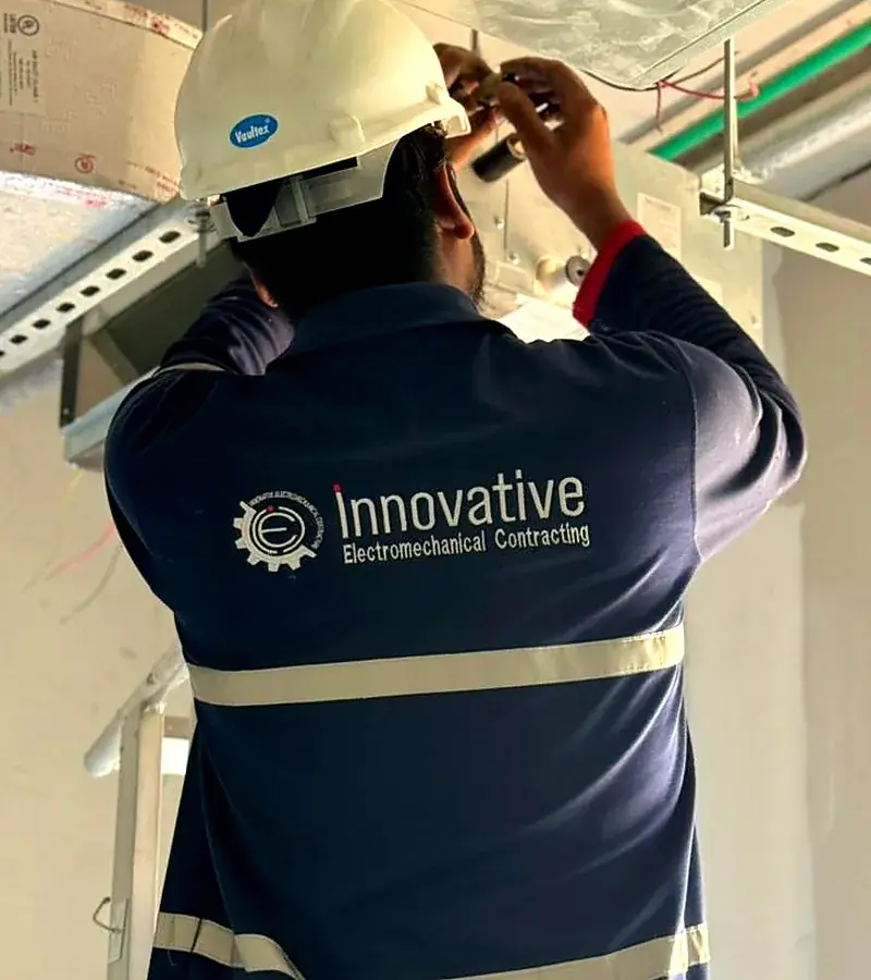 IEC UAE technician carrying out HVAC installation works