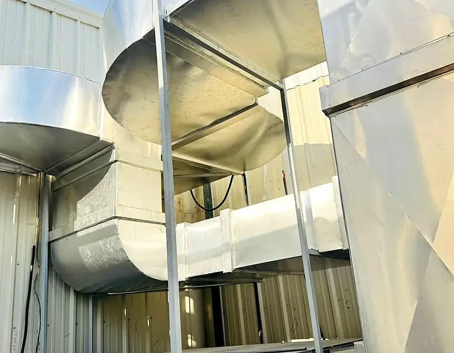 Rooftop packaged AC ductwork for a factory kitchen area
