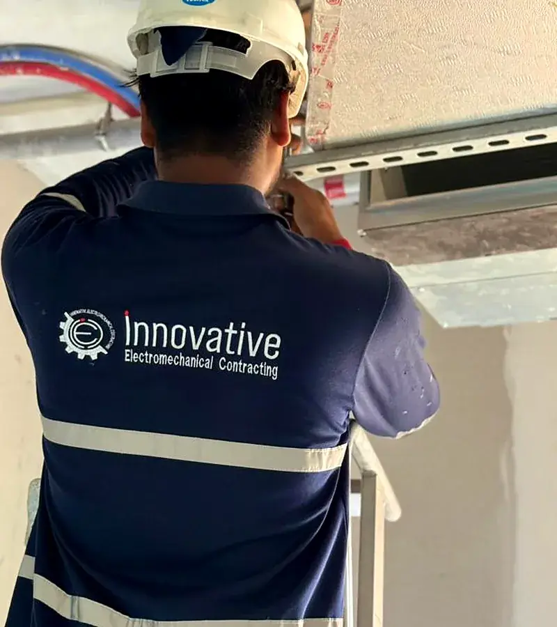 IEC UAE technician installing a ducted indoor unit