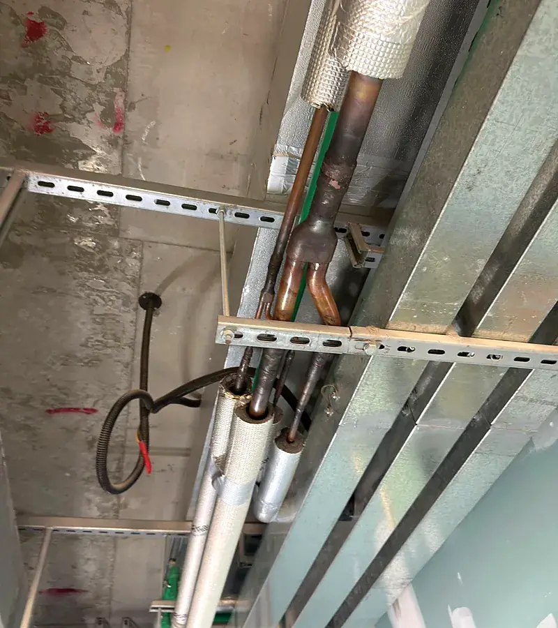 Insulated VRF refrigerant copper piping on cable supports